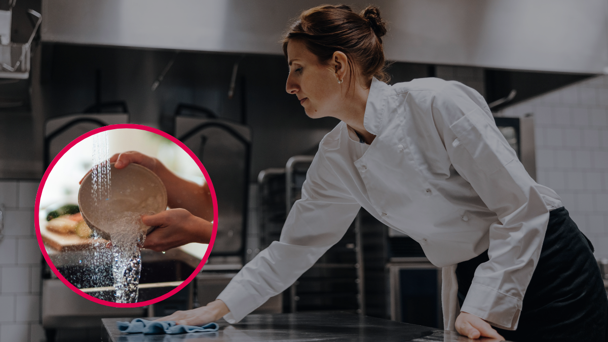 Mujer limpiando una mesa de cocina. Crédito: Getty Images.